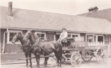 Peter Gertsch driving a Shattuck Dairy wagon