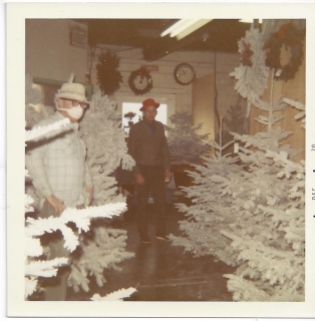 Whitney's Cannery - Flocked Christmas trees - Mask worn due to flocking dust, Mark Whitney in red hat
