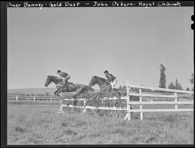1940-06-15 Hunt Club - Omer Bonney (on Gold Dust) and John Osburn (on Royal Chinook) jump their horses over a fence at the Portland Hunt Club in Garden Home