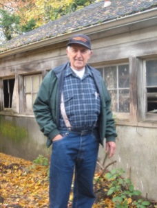 Bob Feldman beside original milking barn, 2011