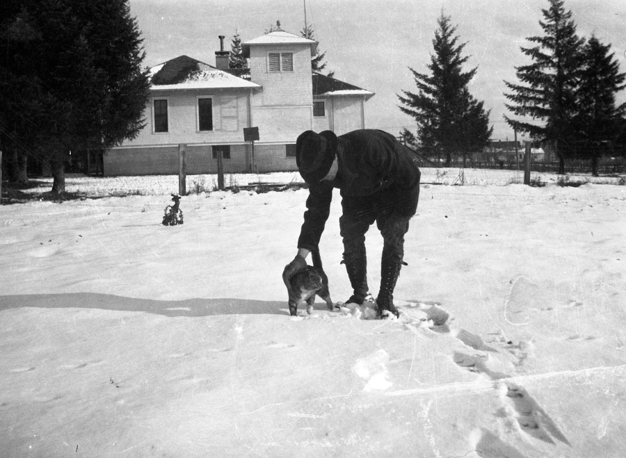 1920s Melvin Replogle and cat near Garden Home School